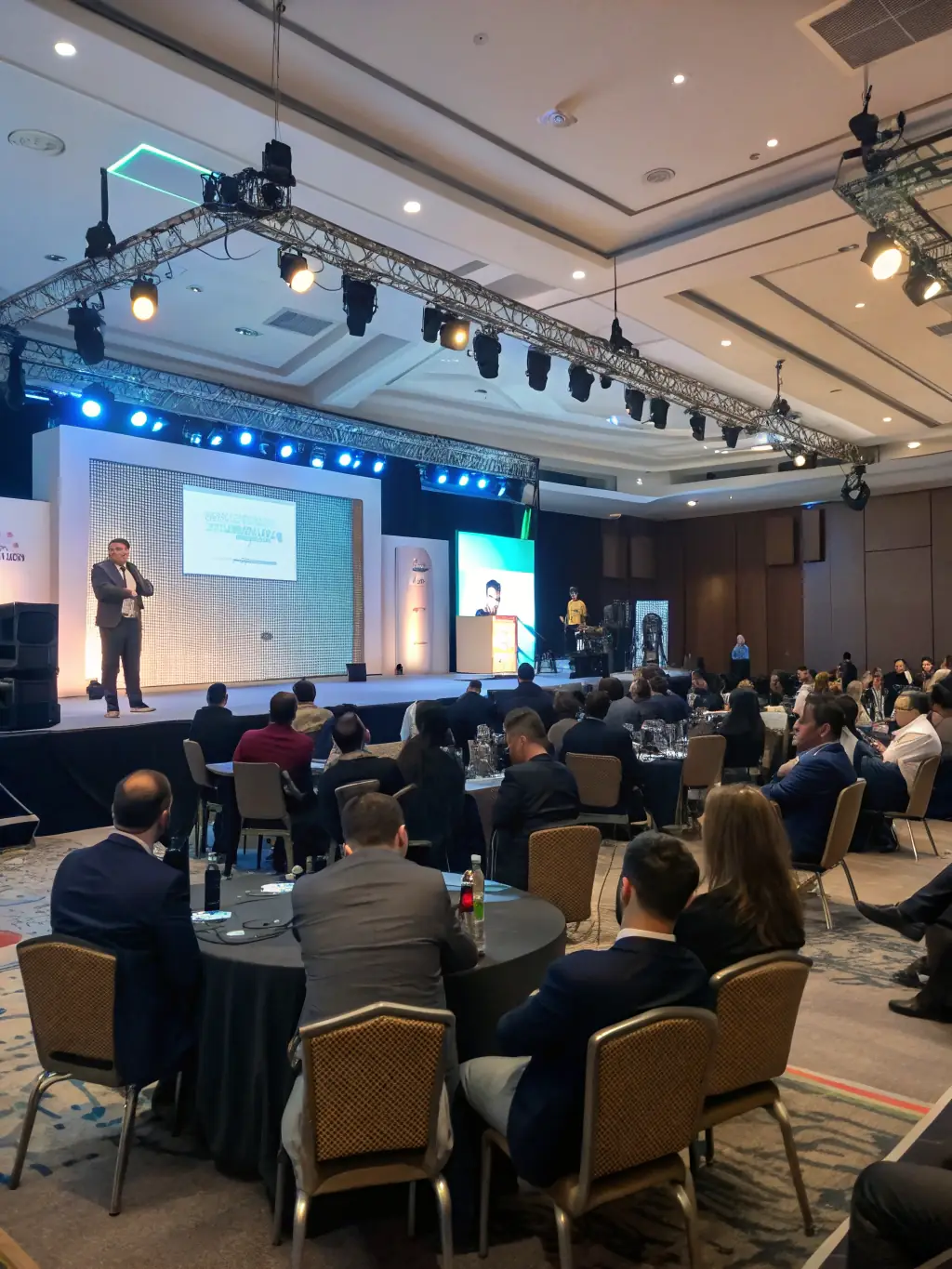 A keynote speaker delivering an inspiring presentation on global business opportunities at the InnovateBusiSum conference, captivating the audience.